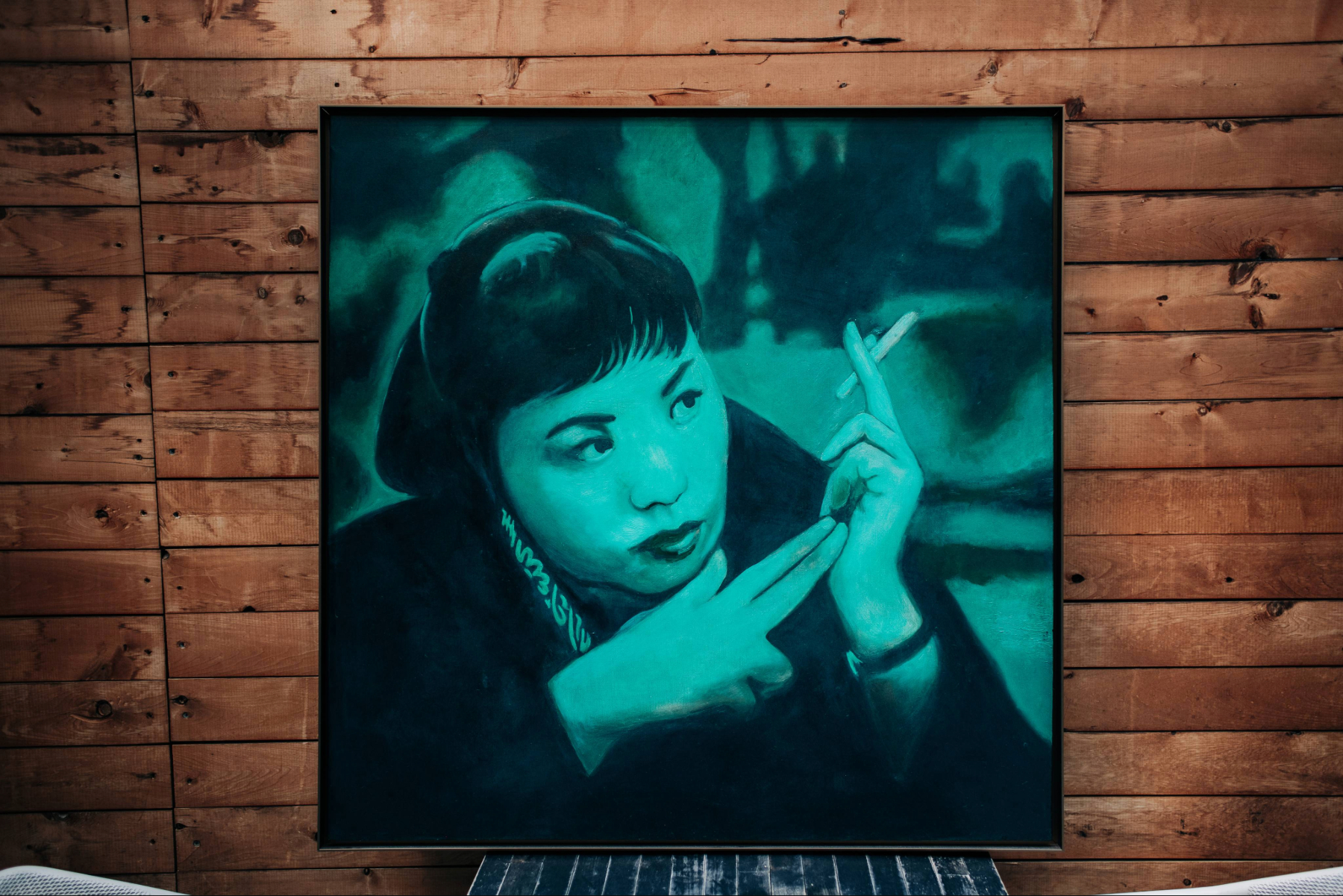 Oil portrait of Toshiko Akiyoshi in teal green